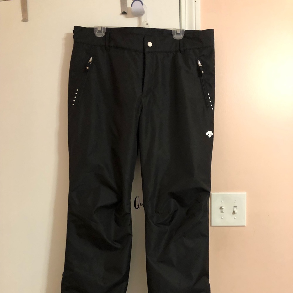 Black Descente snow pants.